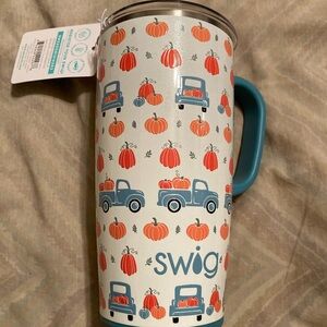 Swig tumbler. 22 oz. Background has sparkles Pumpkin/Truck Design